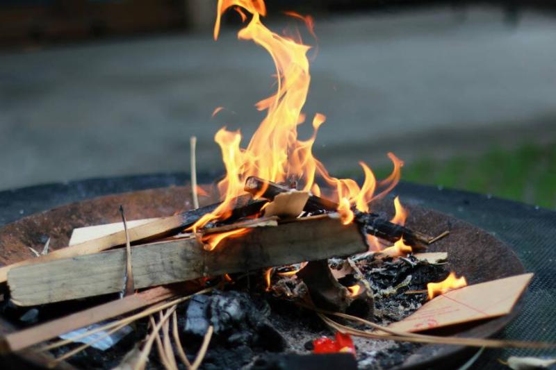 Kindling burning in a firepit.