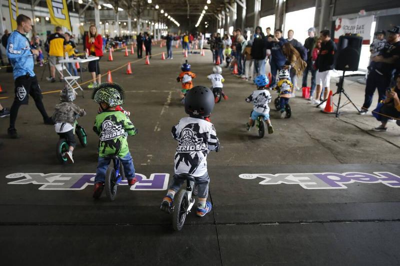 With the drop of the starting gate riders take off and begin the race during the Strider Cup World Championship bicycle race.