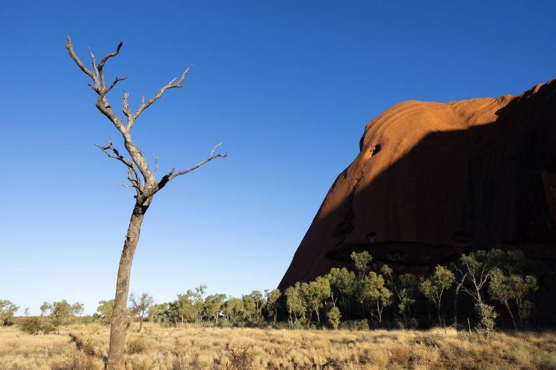 Sunlight on Uluru rock formations.