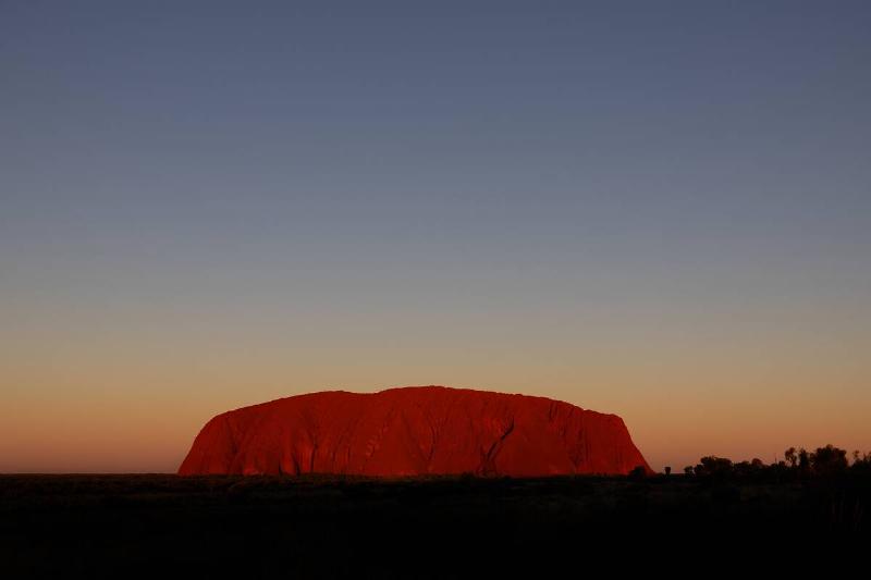 A view of Uluru at sunset.
