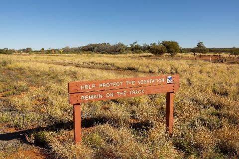 A sign to help protect the environment at Uluru.