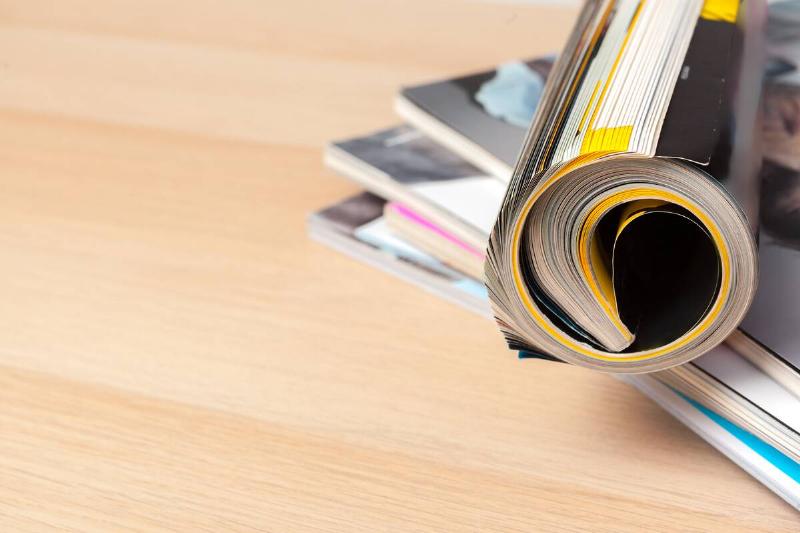 Stacked and rolled magazines. 