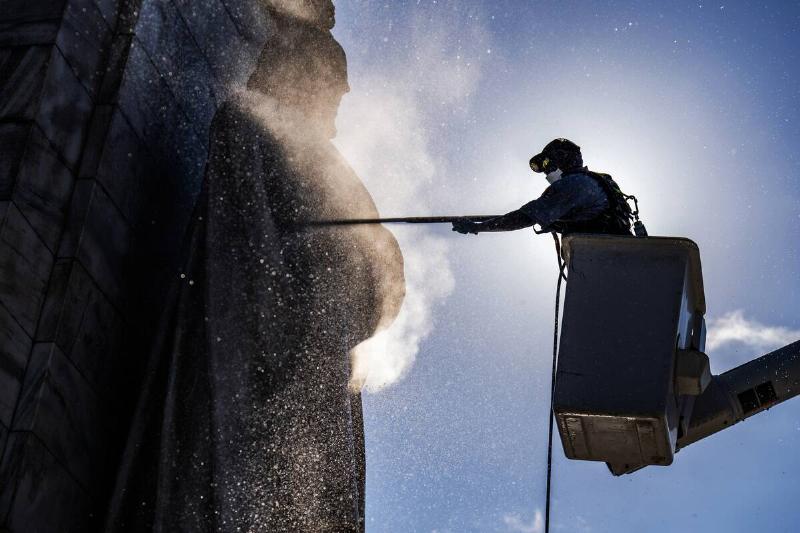 A National Park Service worker washes the Columbus Fountain outside of Union Station on Thursday, July 24, 2025.