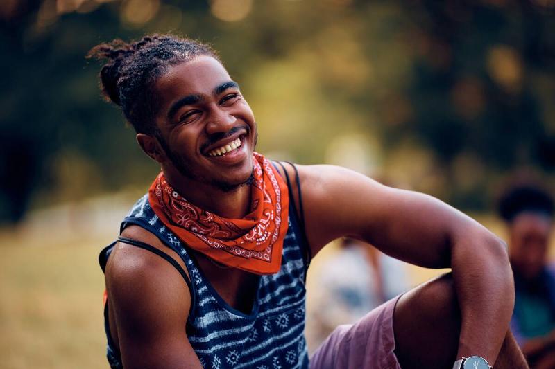 Man wearing bandana around neck.