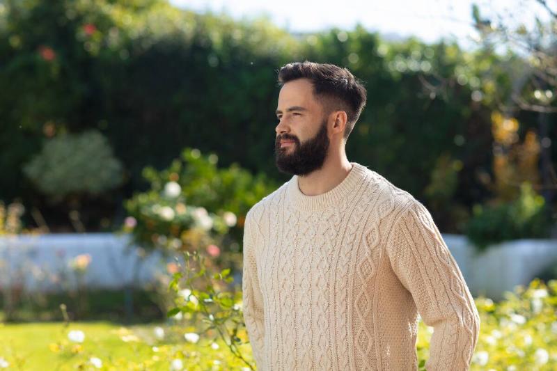 Man wearing wool sweater.