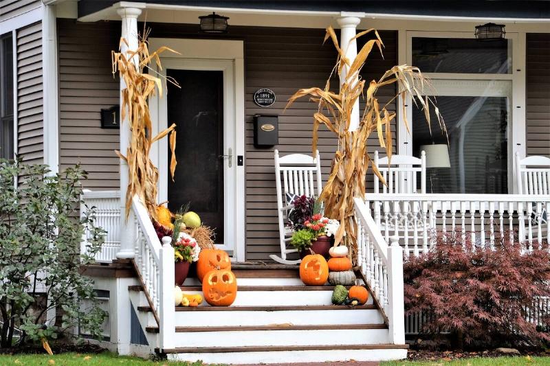 The front of a house decorated for fall. 