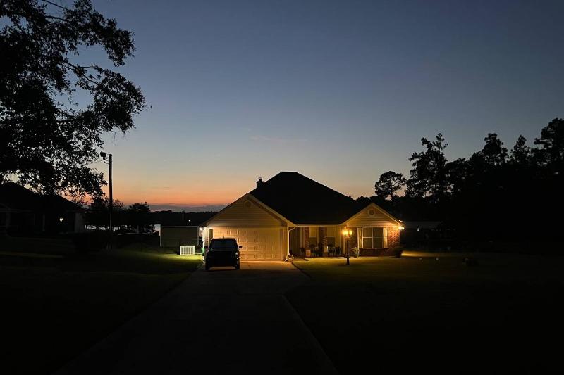 Floodlights on a house at night. 