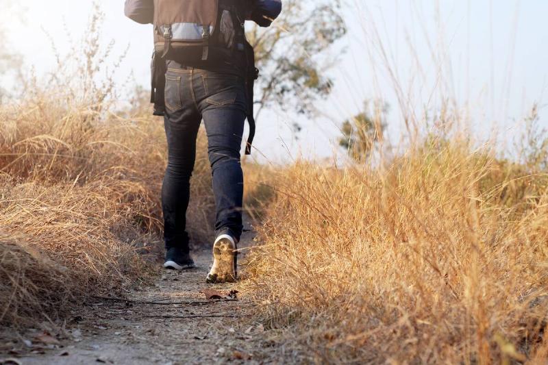 Man walking on hiking path. 