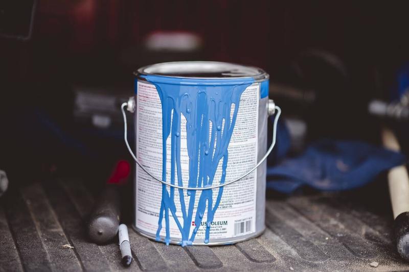 Old can of blue paint. 