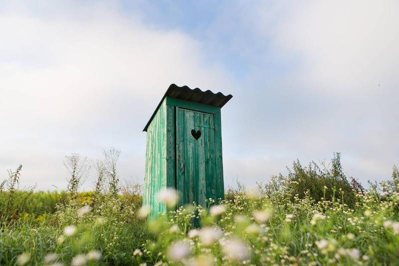 Green outhouse. 