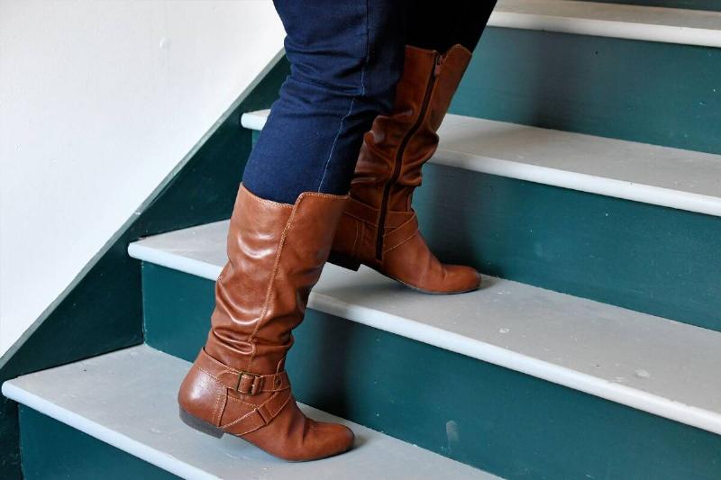 Pants tucked into boots.