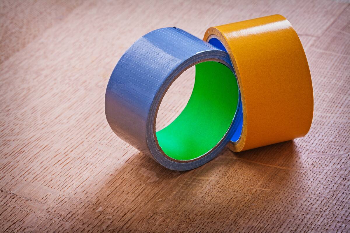 Two rolls of duct tape, one blue, one orange.