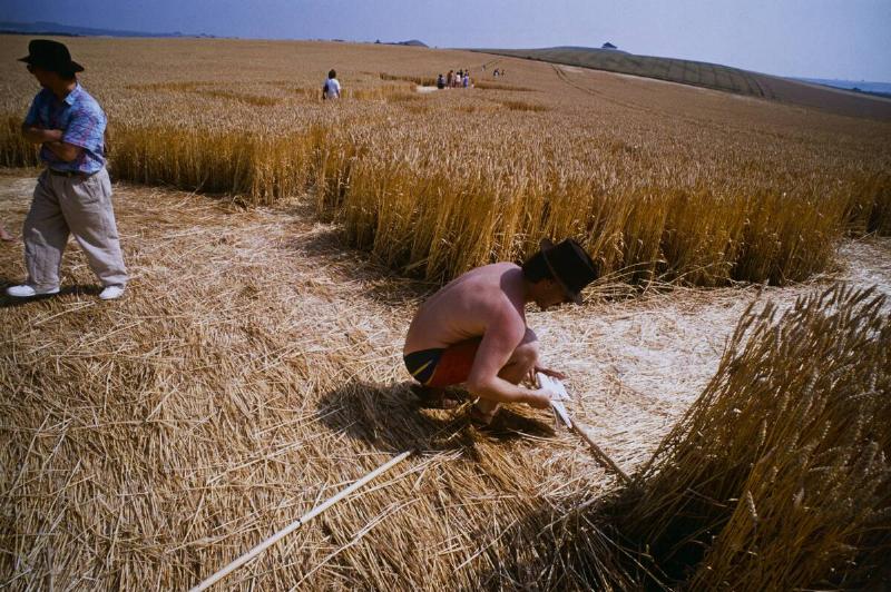 Researchers measuring crop circles in a field near Winchester, UK, 1990.