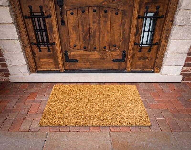 Blank Welcome Mat At Custom Front Door of House.