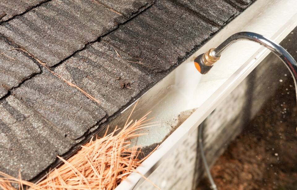 Gutter cleaned by hose attachment. 