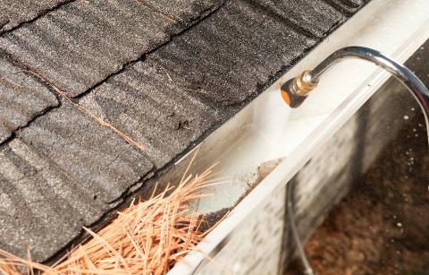 Gutter cleaned by hose attachment. 