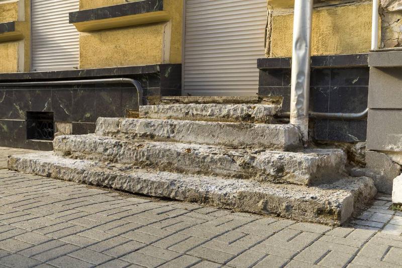 Old ruined concrete stairs before renovation works.