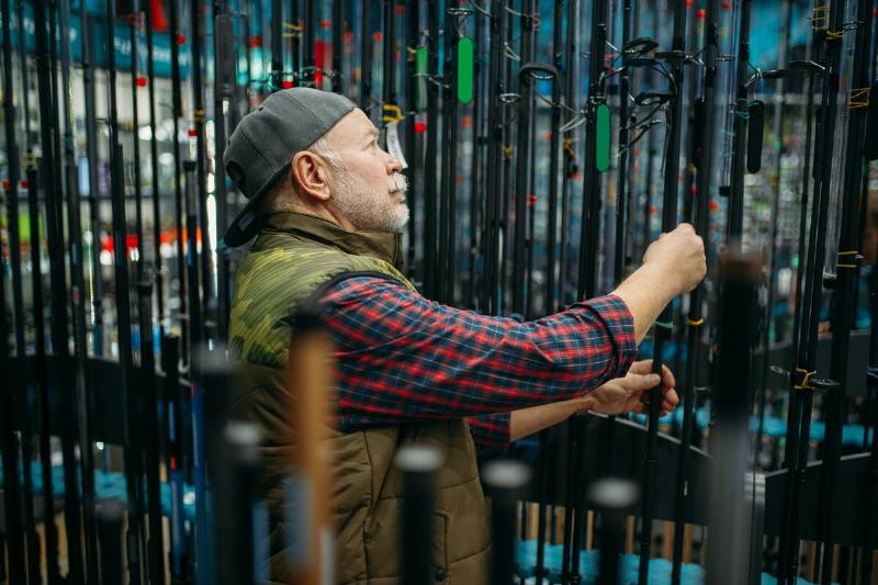 Man buying fishing rod.