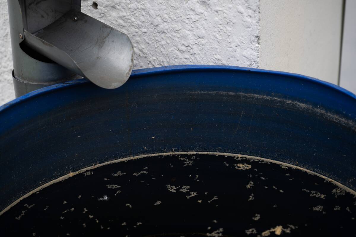 An open rain barrel stands during the presentation of the pilot project  