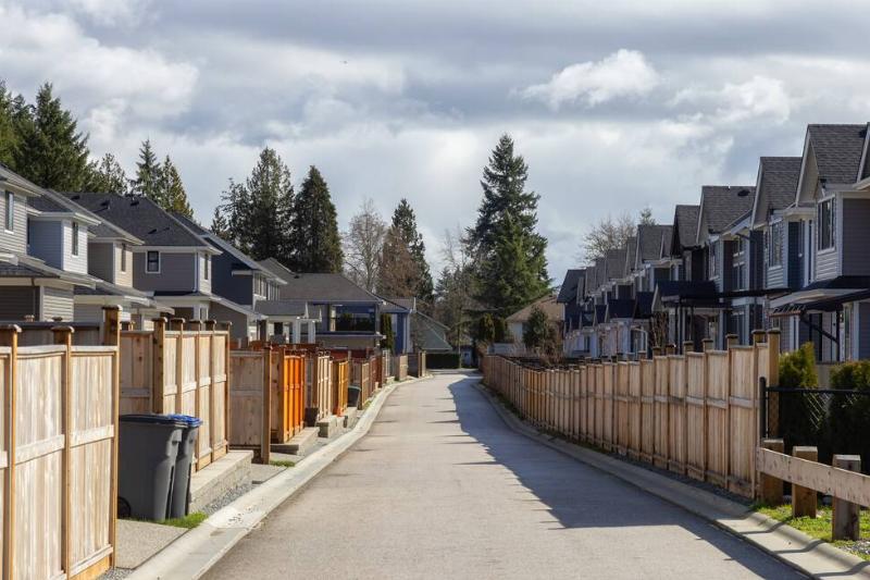 Suburban neighborhood with almost all the same fences.