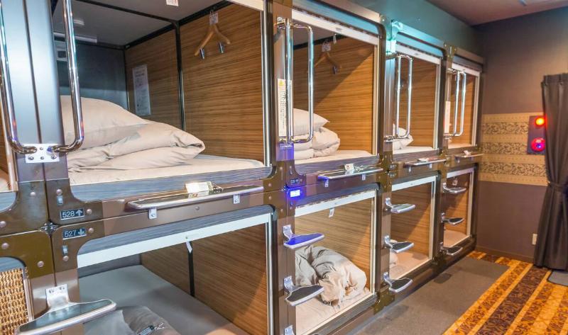 A row of rooms in a capsule hotel in Japan.