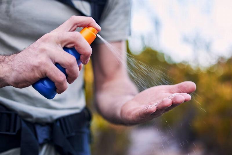 Bug spray on hands.