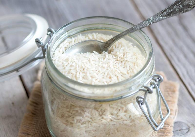 Basmati rice in a glass jar with a spoon