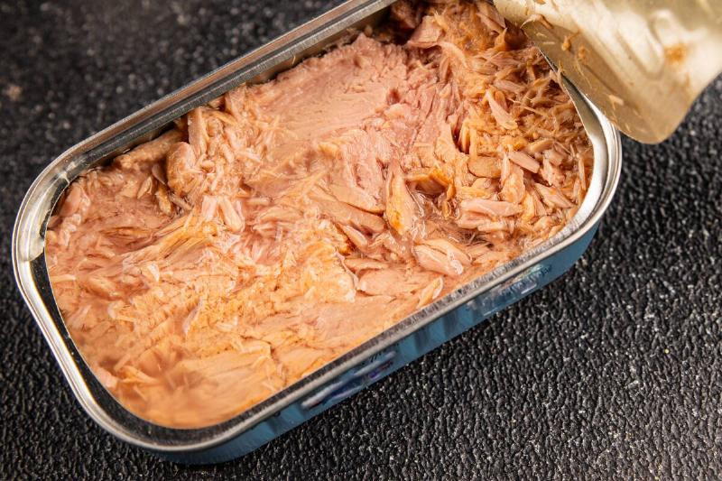 An open rectangular can of tuna.
