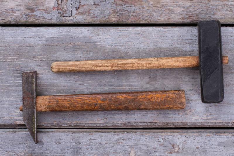 Two hammers with old handles.