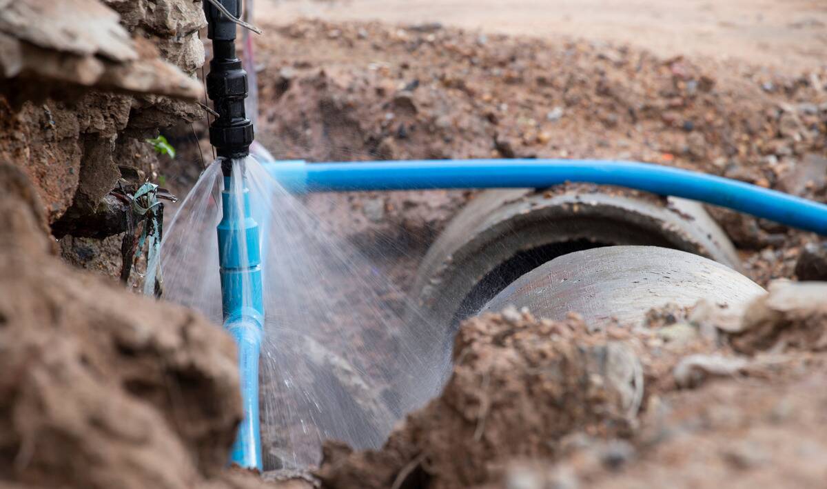 An underground burst water pipe.