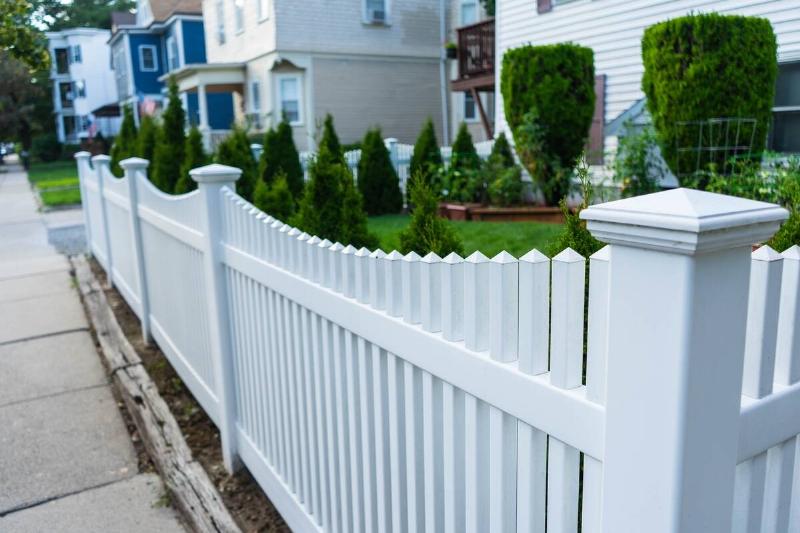 White picket fence in a residential neighborhood. 