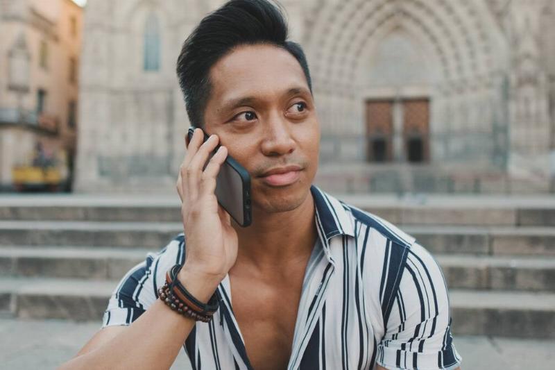Male tourist on a phone call. 