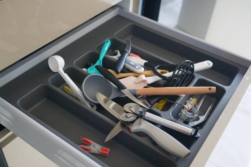 Messy kitchen drawer. 
