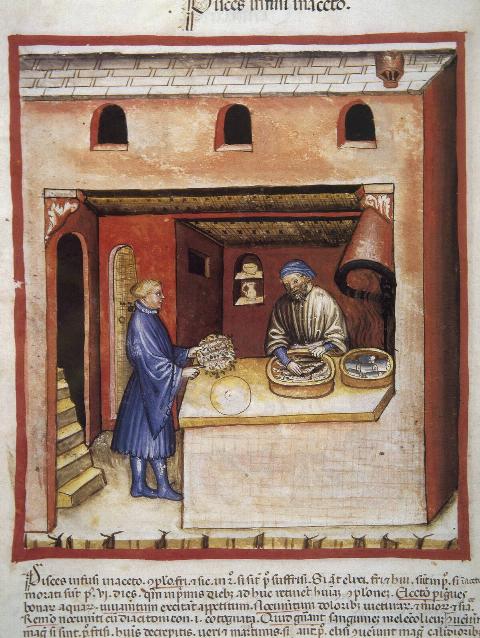 Man Marinating Fish In Vinegar