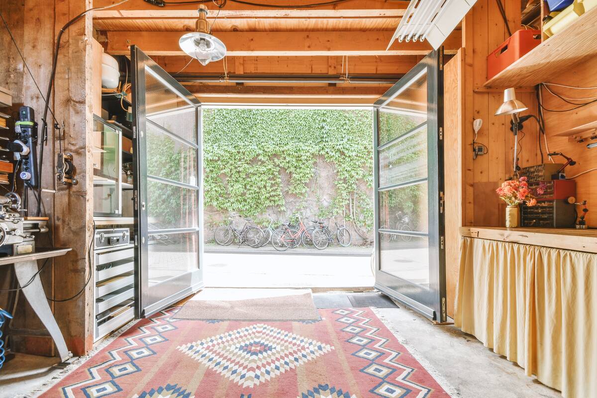 Interior of modern bright laundry room with white walls and dark reflect floor