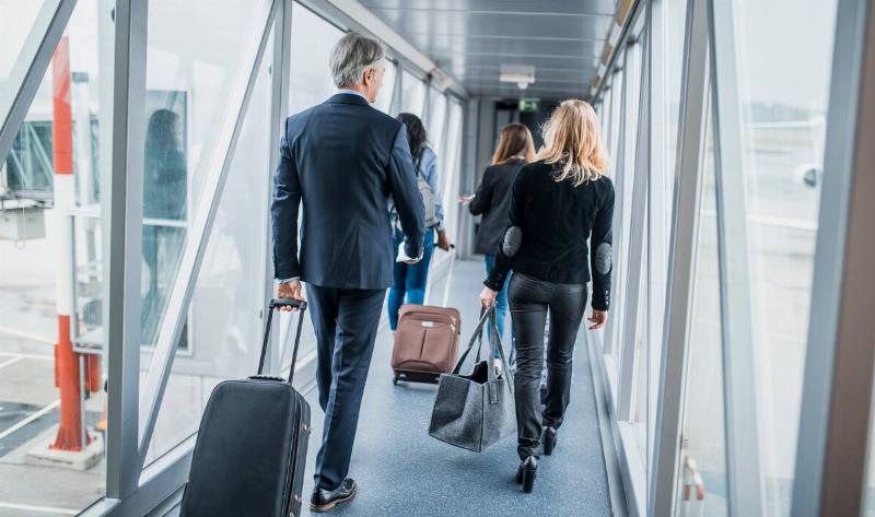 People walking to board a plane.