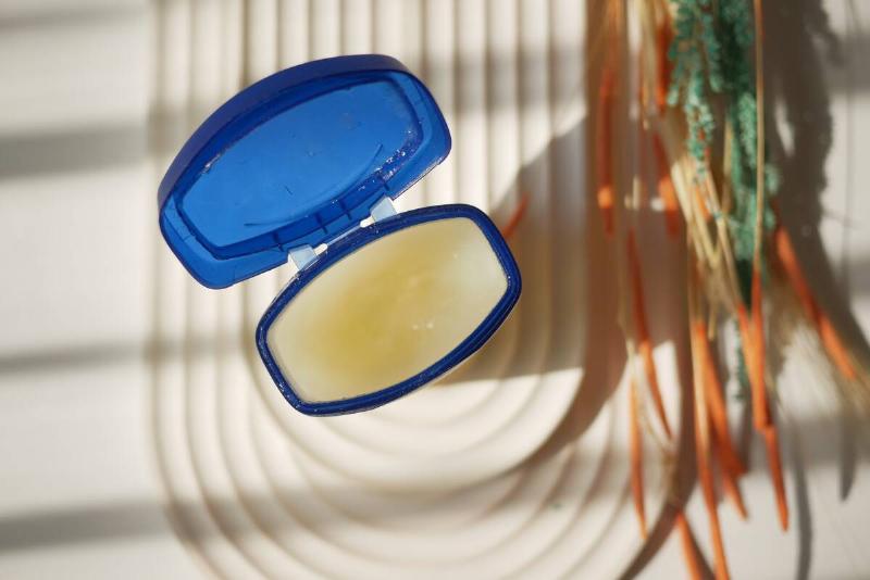 A jar of petroleum jelly open from above.