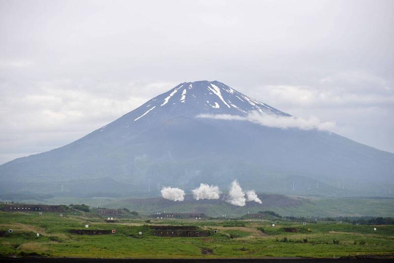 Japanese Self-Defense Forces soldiers take part in an annual military  exercise at the Gotenba training ground, beneath Mount Fuji on June 8, 
2025, in Gotenba, Shizuoka Prefecture, Japan.