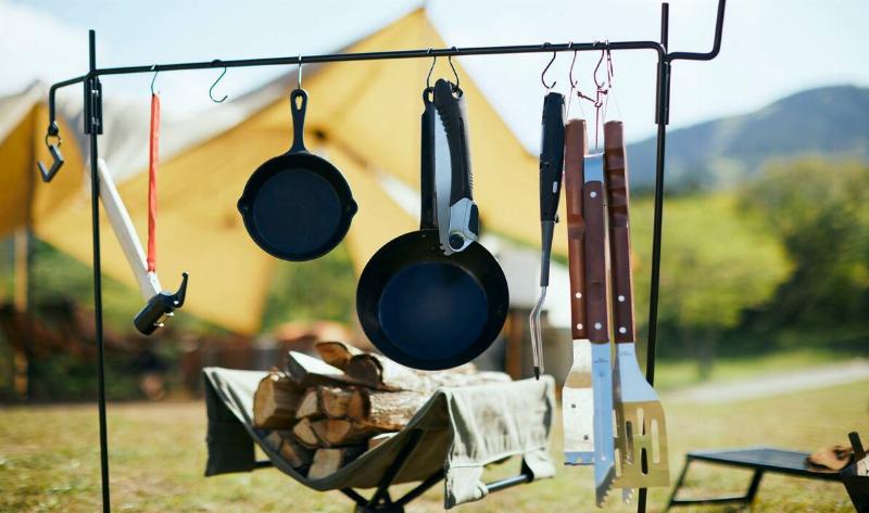 A rack of camping cookware.