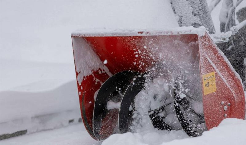 A closeup of a snowblower.