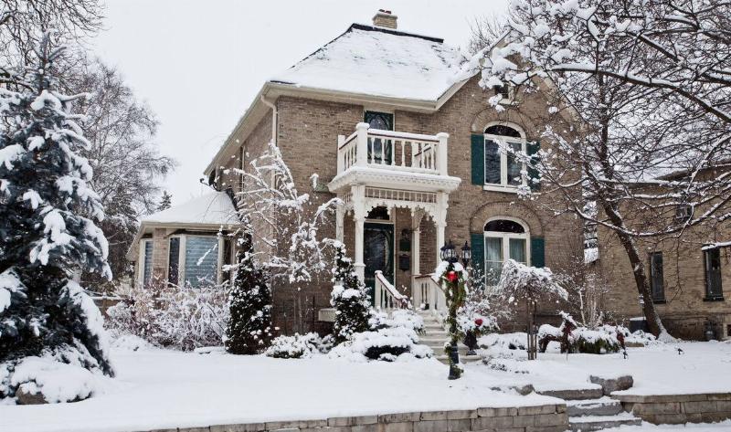 A house in the winter, covered with snow.