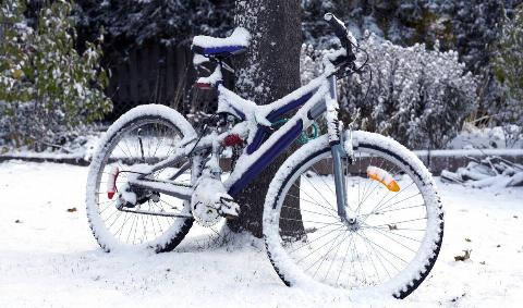 A bike covered in snow.