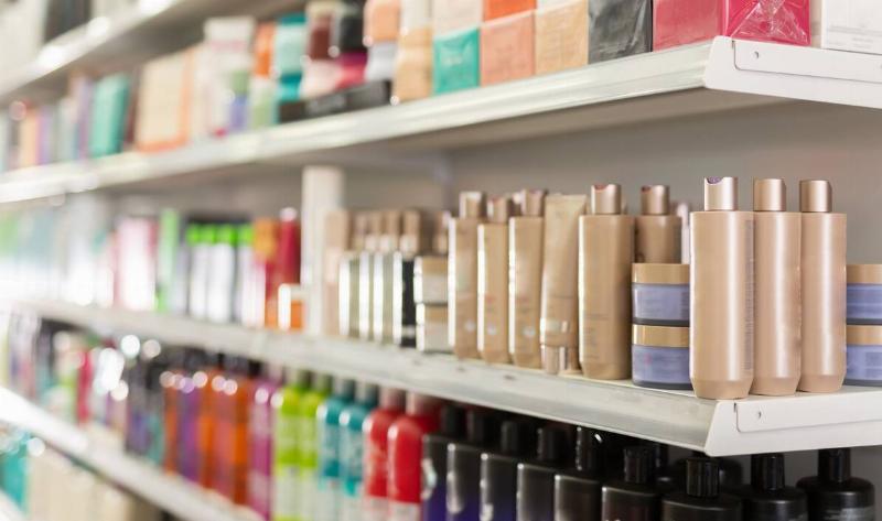 Shelves of shampoo and other hair supplies at a store.