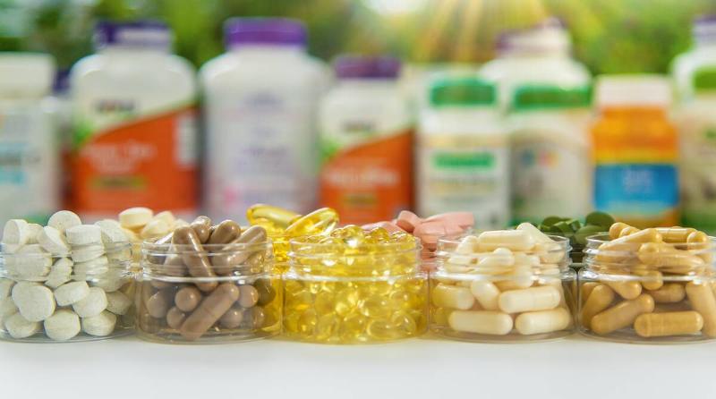 Supplements and vitamins on a white background. Selective focus. Medicine.