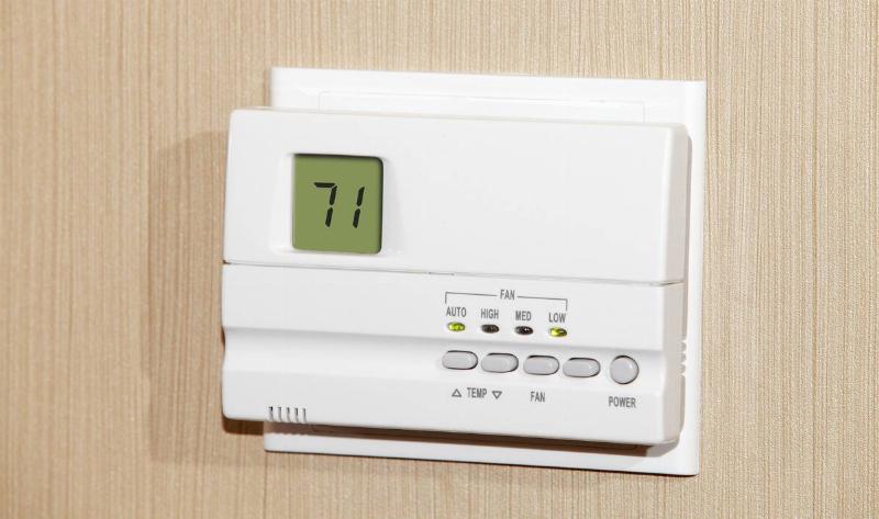 A thermostat on a wall.