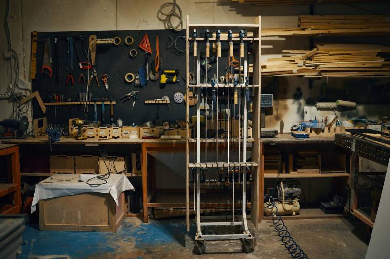 Interior of wood workshop with work tools and lathe