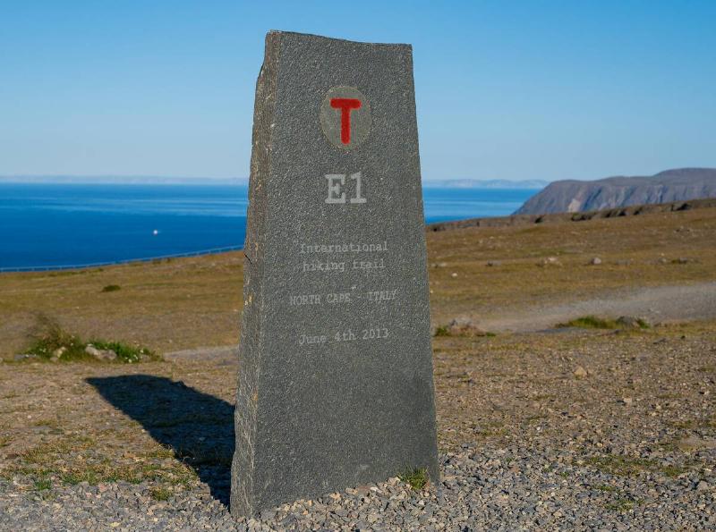 A stone at the North Cape with the start of the E1, the Eupo hiking trail.