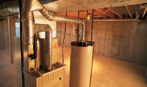 A furnace in an unfinished basement.