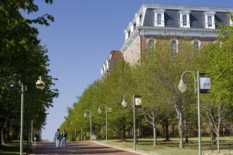 Students talk behind Old Main building on the campus of the University of Arkansas on April 11, 2007 in Fayetteville, Arkansas.