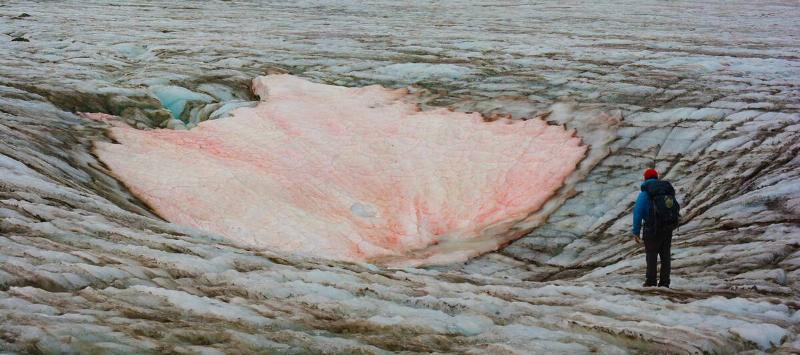 A hiker approaches an eerie shield of 